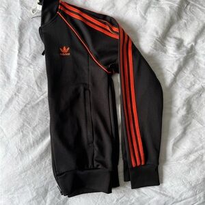 Adidas Kids Black Track Jacket with Orange Stripes